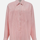 The TWP Something Borrowed Striped Shirt features light pink, long sleeves, a button-up front, collar, chest pocket, and subtle stripe texture—ideal stylish workwear for women. Displayed on a plain white background.