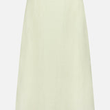 The A-Line Linen Skirt by TWP is a lightweight, light cream-colored workwear skirt for women featuring an A-line silhouette, shown on a white background.