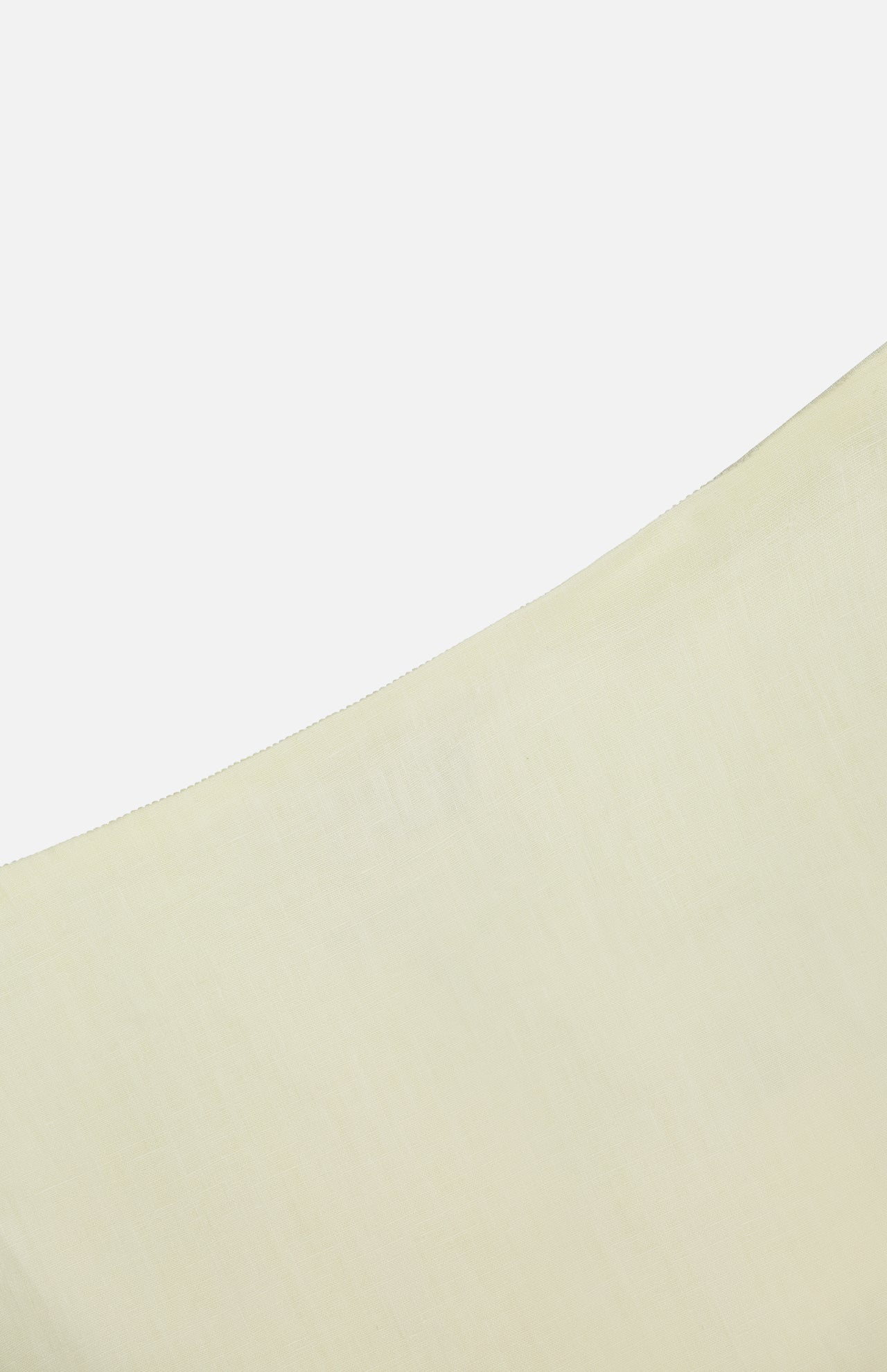 A close-up of TWP's The A-Line Linen Skirt in light beige, featuring smooth linen texture, is photographed against a plain white background—an ideal workwear piece for women.