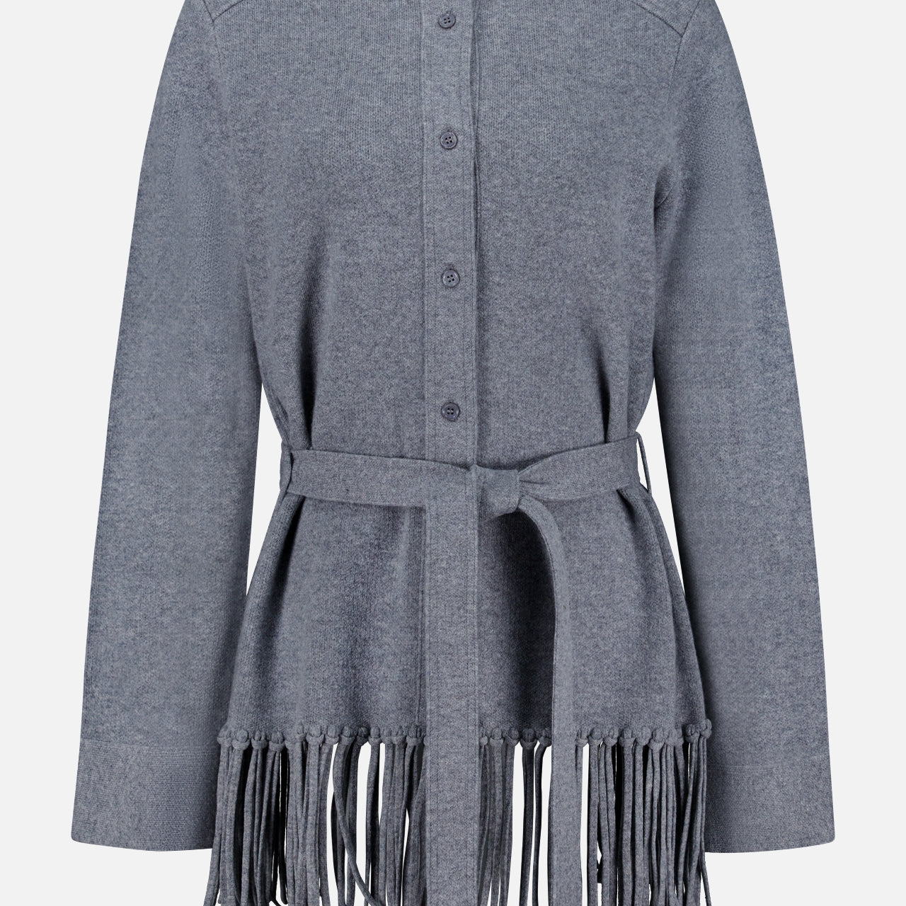 The TWP Thea Fringed Hem Cardigan is a gray button-up style, expertly crafted from luxurious Italian cashmere, featuring a belted waist and long fringe detailing at the hem—an elevated staple for women’s workwear, shown against a white background.