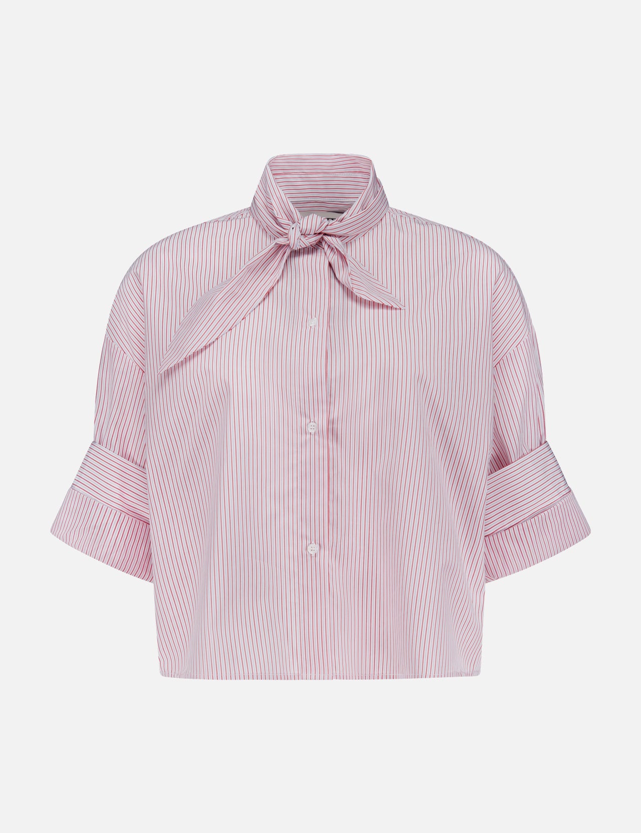 The TWP Tie One On Striped Shirt features red and white vertical stripes, short sleeves with wide cuffs, a bow tie collar, and front buttons—ideal for nautical looks or chic women’s workwear.