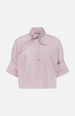 The TWP Tie One On Striped Shirt features red and white vertical stripes, short sleeves with wide cuffs, a bow tie collar, and front buttons—ideal for nautical looks or chic women’s workwear.