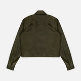 A back view of the Tied Up In You Shirt by TWP, a long-sleeve olive green leather button-down shirt jacket featuring a collar, buttoned cuffs, and a straight hem, displayed on a plain white background.