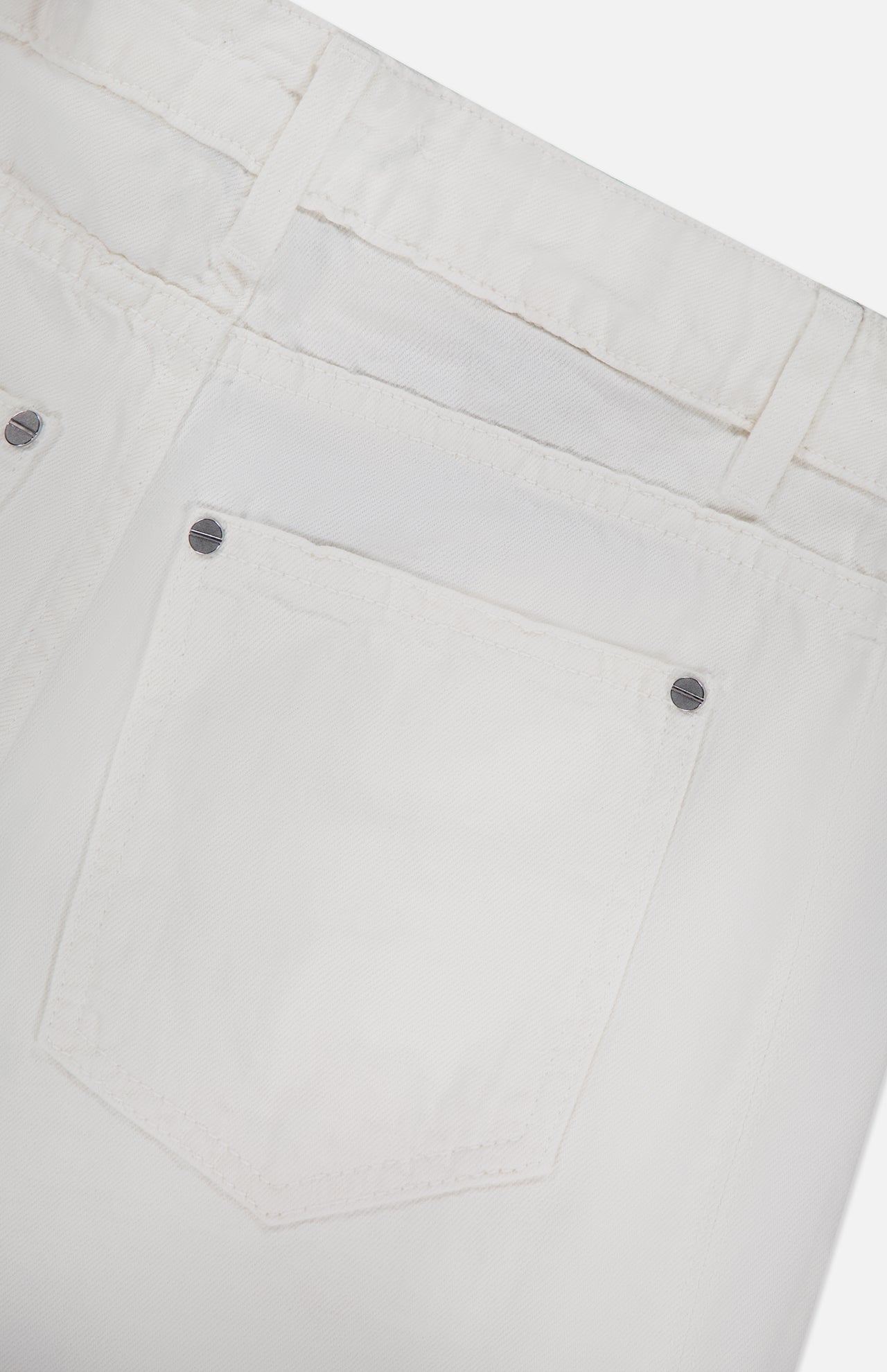 Close-up of the back pocket on the TWP West 11th St Pant in linen-cotton denim, featuring stitching details, belt loops, and metal rivets for a durable women's workwear style.