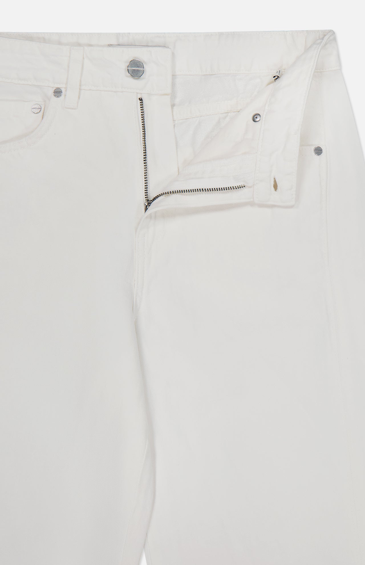 Close-up of the TWP West 11th St Pant in white linen-cotton denim, featuring a detailed waistband, unique pocket design, a partially undone front zipper, and unfastened top button—modern workwear style for women.
