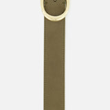 A close-up of the TWP Wide Leather Belt in olive green suede with a large, oval gold buckle, displayed against a white background.