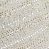 Close-up of the TWP Wide Neck Long Sleeve Knit Sweater in an ivory linen-silk blend, featuring open-knit texture with horizontal holes and loops—ideal for women’s workwear blending comfort and style.