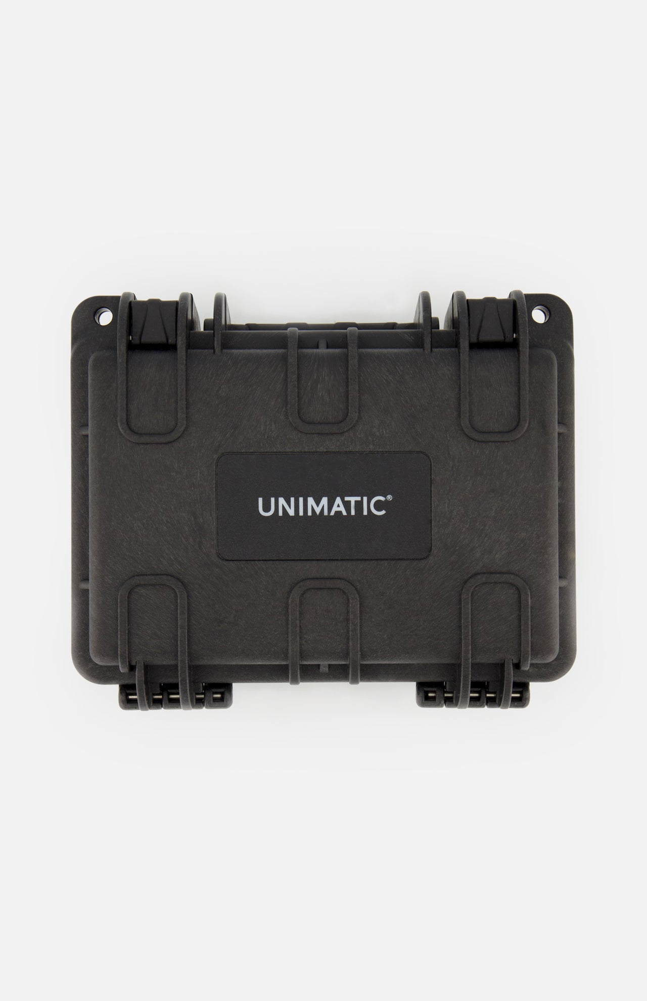 A black protective case with sturdy latches and a white UNIMATIC logo on the center label, photographed against a plain white background—ideal for securely storing your Unimatic Watch Kit U1S-PD6-RB diving watch with Swiss automatic movement.