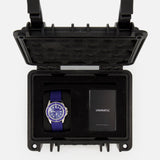 The UNIMATIC Watch Kit U1S-PD6-RB features a blue Unimatic diving watch and a black card, both housed in a black foam-padded protective case with an open lid, proudly displaying its precise Swiss automatic movement.