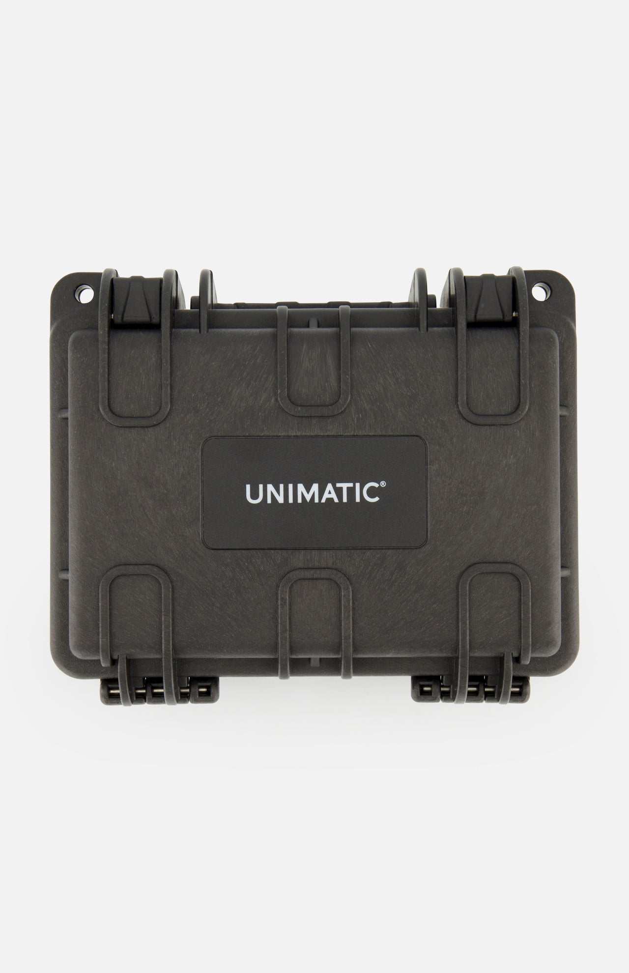 The Unimatic Watch Kit U3FB-ROPS by UNIMATIC is a black, rectangular hard-shell protective case with "UNIMATIC" printed in white on the center of the front panel. Designed to complement your Italian diving watch, this case features sturdy latches and reinforced corners for enhanced durability.