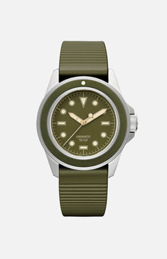 The UNIMATIC Unimatic Watch Kit U1S-8O is an Italian diving watch featuring an olive green dial, textured rubber strap, stainless steel case, gold hands, minimal markings, and Super-LumiNova accents.