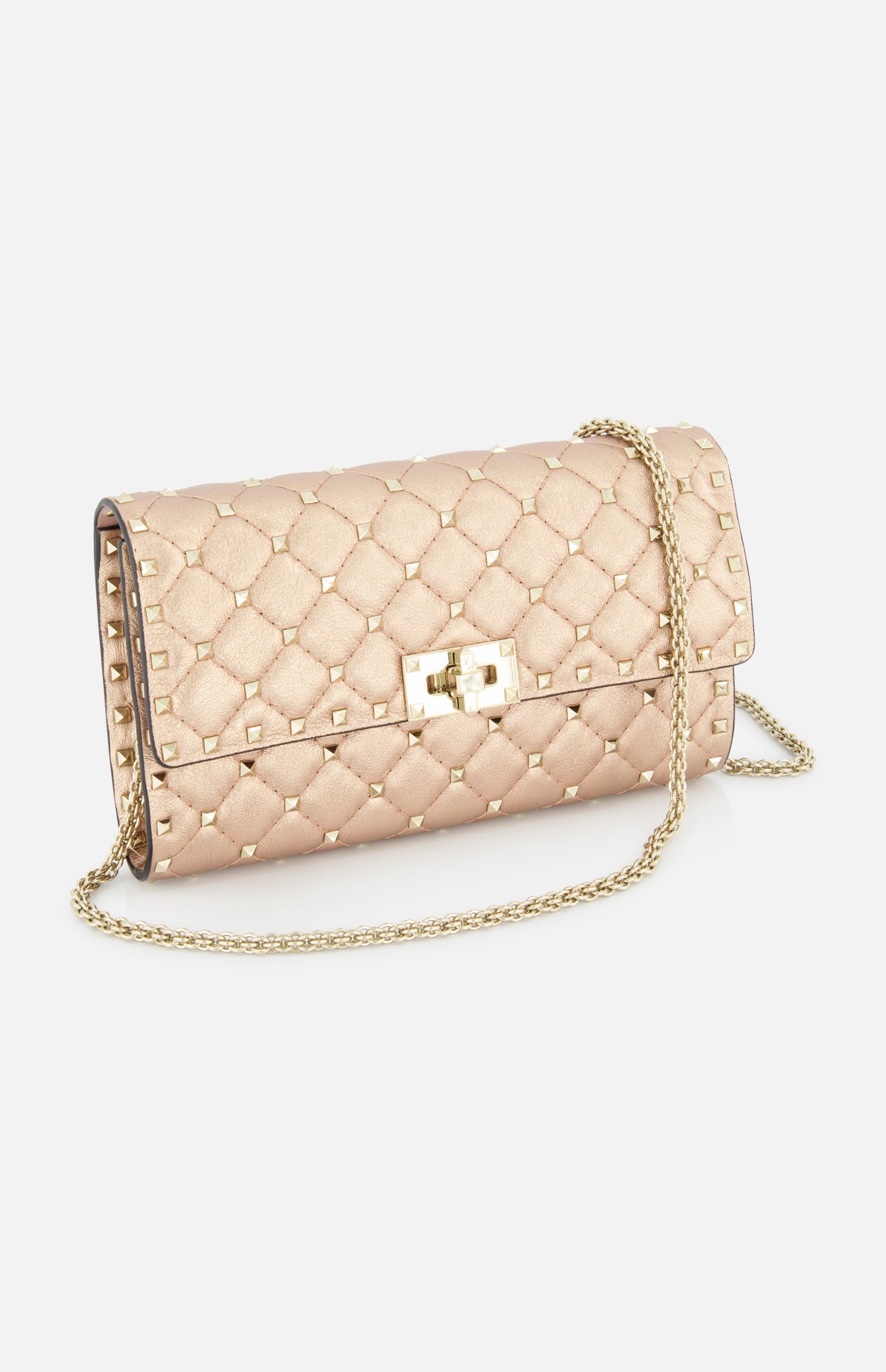 The VALENTINO GARAVANI Rockstud Spike Shoulder Bag is a quilted metallic gold clutch with gold studs, a removable chain strap, and a rectangular gold clasp, shown against a white background.