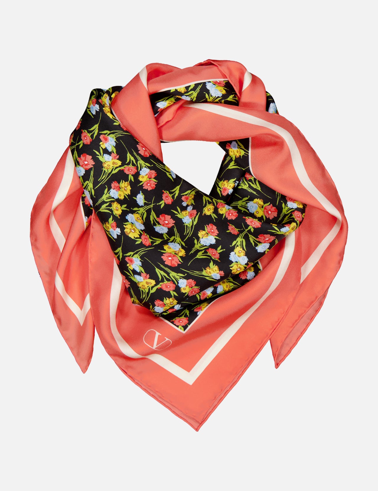 The VALENTINO GARAVANI Shawls Fouland Silk Scarf is a square Italian-made silk scarf with a coral pink border, black center, and colorful floral print in red, yellow, and green, styled in a loose, layered fold.