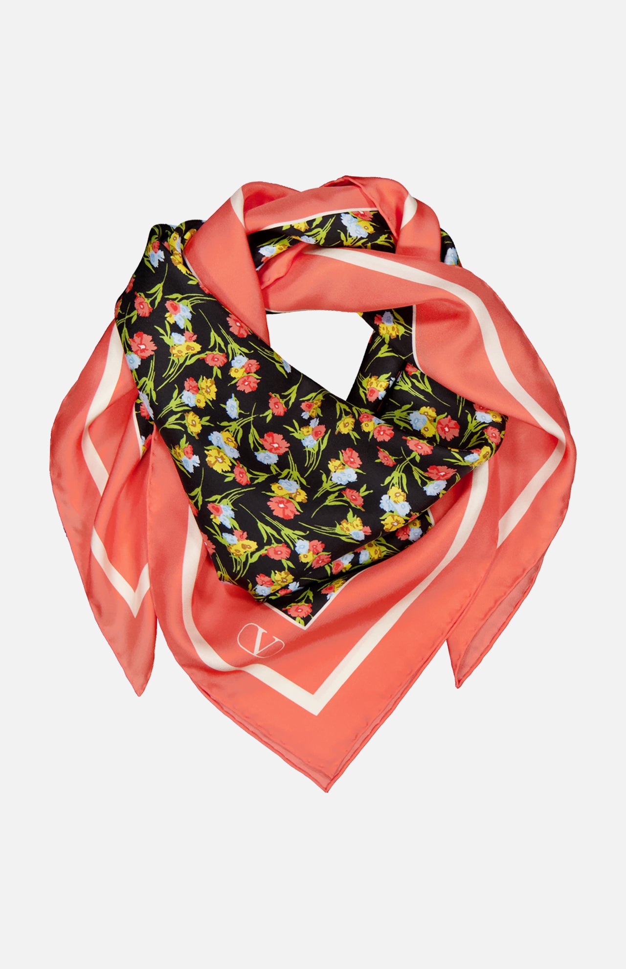 The VALENTINO GARAVANI Shawls Fouland Silk Scarf is a square Italian-made silk scarf with a coral pink border, black center, and colorful floral print in red, yellow, and green, styled in a loose, layered fold.