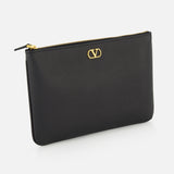 The V Logo Signature Medium Flat Pouch by VALENTINO GARAVANI is a black leather clutch with a gold zipper and small gold logo on the front, shown against a white background.