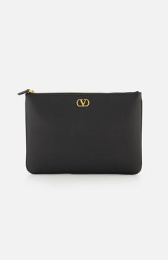 The VALENTINO GARAVANI V Logo Signature Medium Flat Pouch is a black leather clutch featuring a gold logo on the front, shown against a white background.