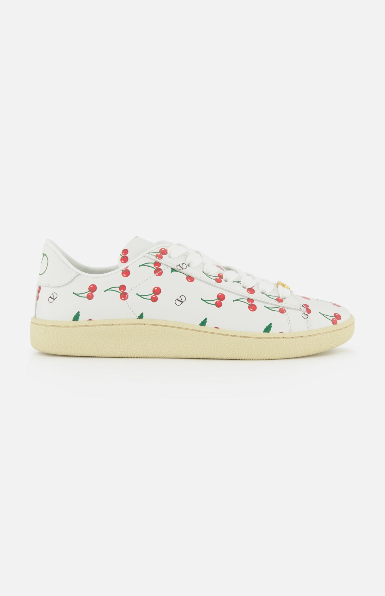 The Valentino Garavani Royco Sneaker by VALENTINO GARAVANI features white leather, a beige sole, and playful red cherry and green leaf motifs for a fresh designer look.