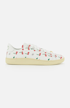 The Valentino Garavani Royco Sneaker by VALENTINO GARAVANI features white leather, a beige sole, and playful red cherry and green leaf motifs for a fresh designer look.