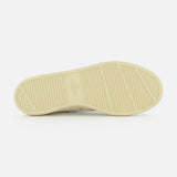 The image displays the beige rubber sole of the Valentino Garavani Royco Sneaker, featuring textured grip patterns and VALENTINO GARAVANI branding at the center, photographed against a white background.
