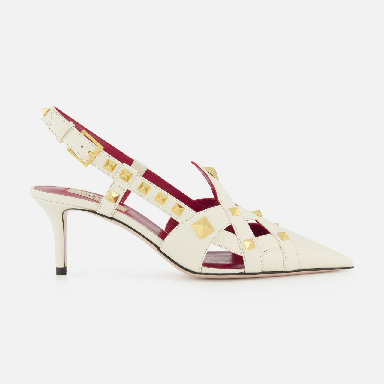 The Valentino Garavani Studdy Sling Back Heel T.65 features ivory leather, pointed toe, gold square studs, strappy ankle strap design, mid-height stiletto heel, and pink-red inner lining against a white background.