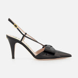 The Bowow Sling Back Heel by VALENTINO GARAVANI is a black leather pump with a pointed toe, decorative front bow, and an adjustable ankle strap with buckle.