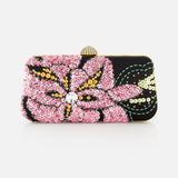The Carry Secrets Miniaudiere Bag by VALENTINO GARAVANI is a rectangular evening bag with pink floral sequin patterns, gold sequins, and green stitched accents on black, topped with a round metallic clasp.