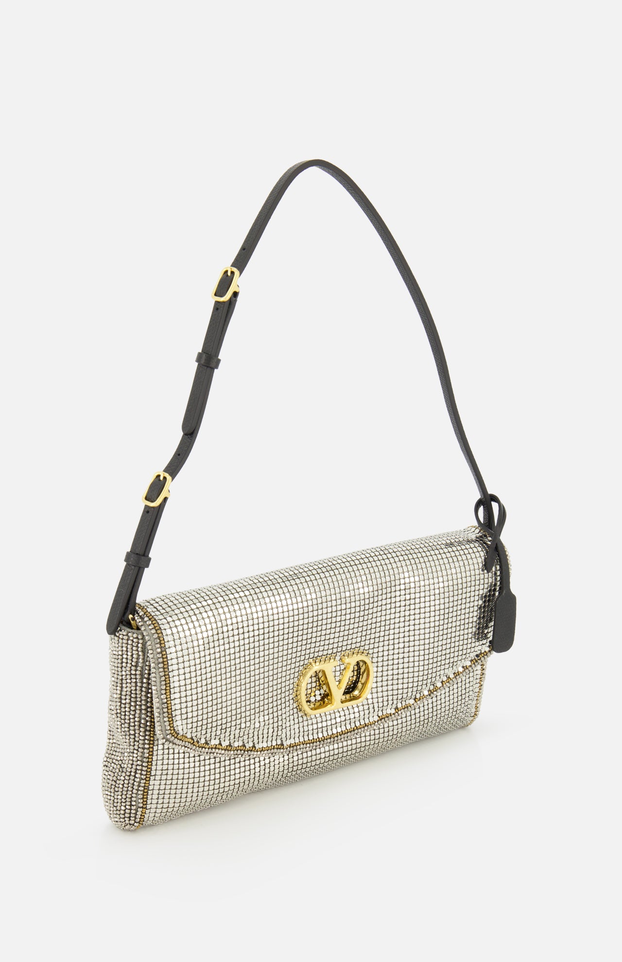 Valentino Garavani Devain Sequin Shoulder Bag featuring a rectangular silver sequin body, gold logo clasp, adjustable black strap, and a glittering finish.