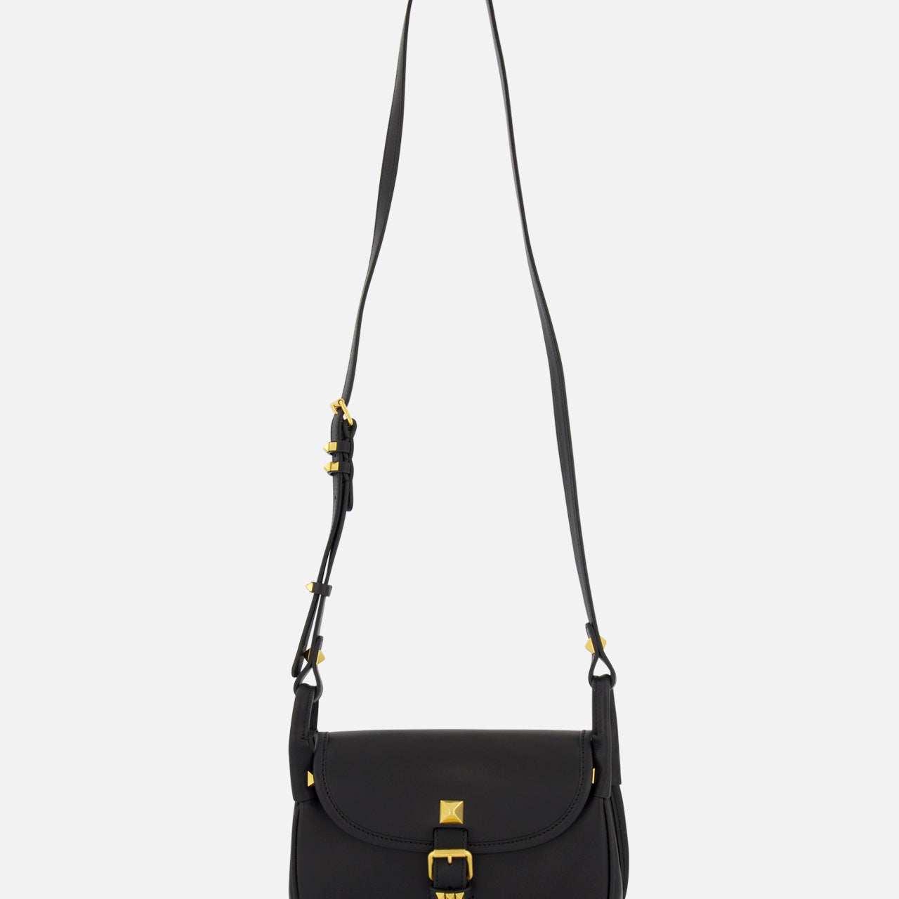 The VALENTINO GARAVANI Flaneuse Small Shoulder Bag in black leather showcases gold hardware, a long adjustable strap, and a front flap with gold buckle detail—an elegant designer accessory for any occasion.