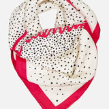 The VALENTINO GARAVANI Foulards Polka Dot Shawl features a white silk base with black polka dots, a bold pink border, and a wavy pink accent along one edge.