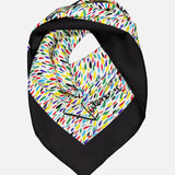 The VALENTINO GARAVANI Foulards Painterly Logo Shawl is a square silk scarf featuring a black border, vibrant multicolored abstract brush stroke print, and a stylish signature displayed on one corner.