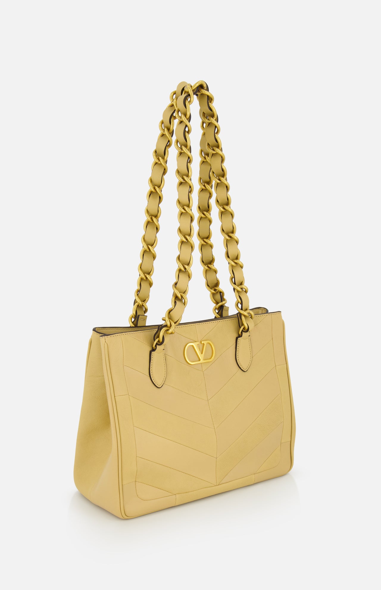 The VALENTINO GARAVANI Laseine Small Tote Bag, in gold-beige with gold chain straps and a gold V logo on the front, is photographed against a plain white background.