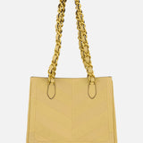 The VALENTINO GARAVANI Laseine Small Tote Bag features a gold-beige chevron design and two thick gold chain handles, elegantly displayed against a plain white background.