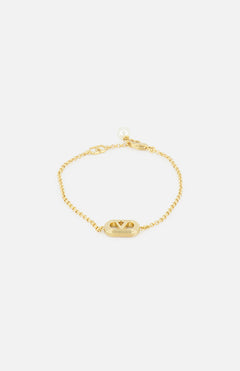 The VALENTINO GARAVANI Ovalette Pearl Bracelet features a gold-tone chain with an oval charm and triangular detail, plus a Swarovski pearl accent near the clasp, shown against a white background.