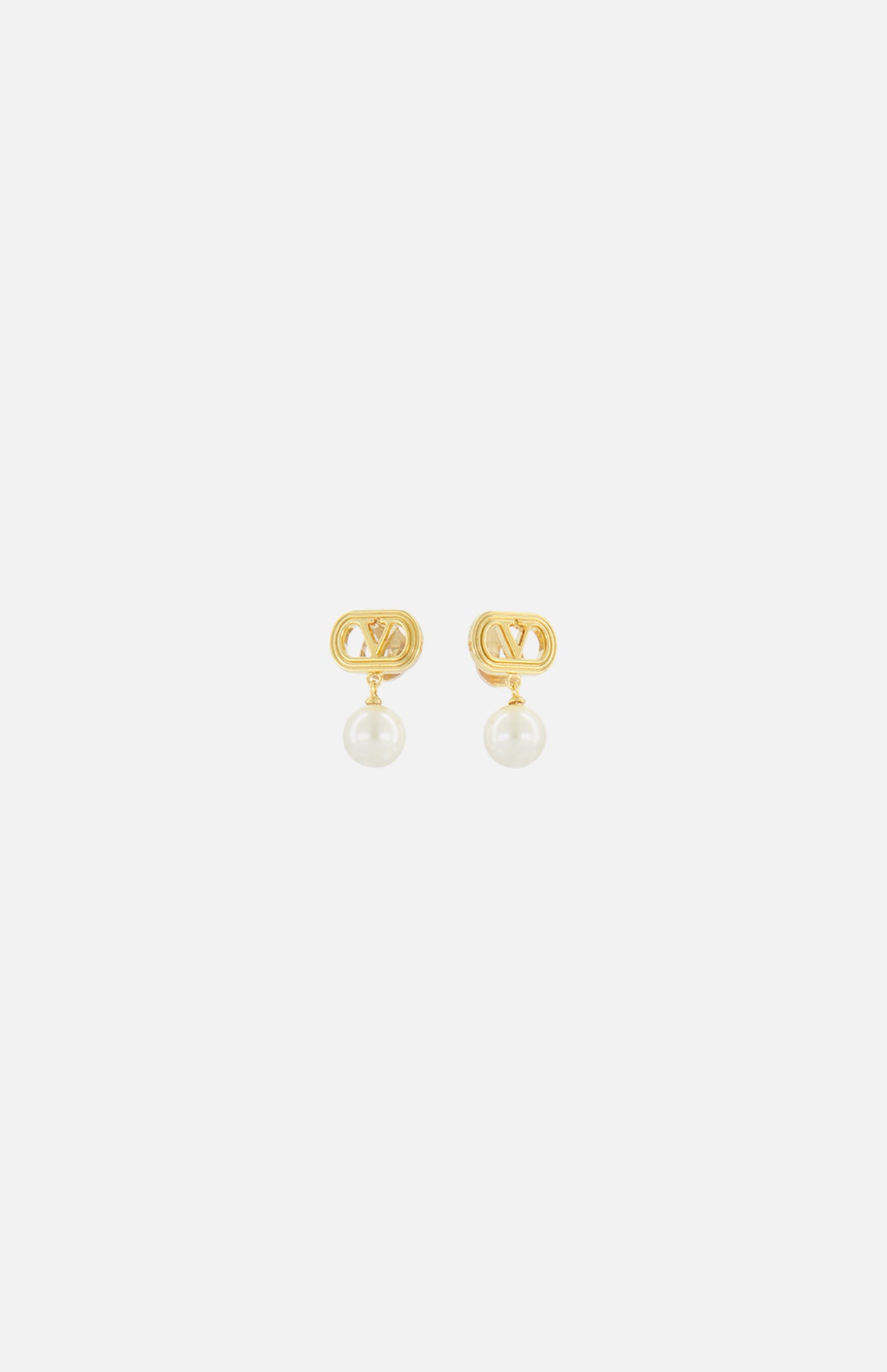 The VALENTINO GARAVANI Ovalette Logo Pearl Earrings feature gold-tone interlocking V logos with a single round white pearl drop, shown on a plain white background.
