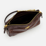 The Panthea Small Patchwork Shoulder Bag by VALENTINO GARAVANI is a dark brown shoulder bag crafted from luxurious suede and leather, featuring a gold zipper, gold clasp detail, and a short handle. Shown from above with the bag open to reveal the interior, this handbag combines timeless elegance with modern sophistication.