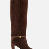 The VALENTINO GARAVANI Pattie Suede Ankle Strap Boot is a knee-high brown suede equestrian boot featuring a block heel, pointed toe, and a leather strap with a small gold buckle around the ankle, displayed on a white background.