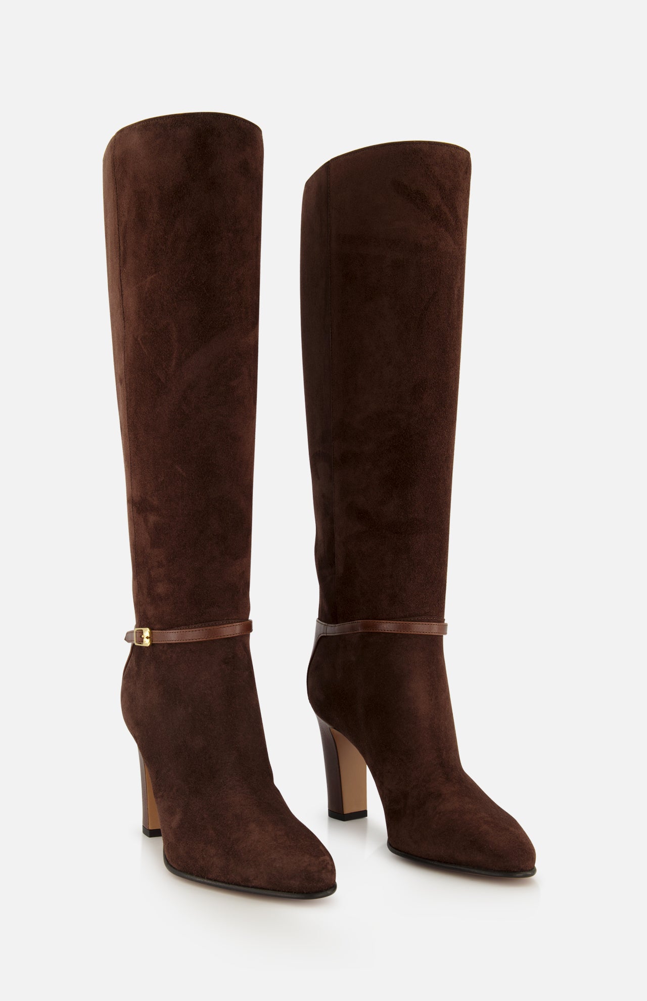 The VALENTINO GARAVANI Pattie Suede Ankle Strap Boot is a pair of tall, dark brown suede boots featuring rounded toes, slim ankle straps, and a sleek block heel, displayed against a plain white background.