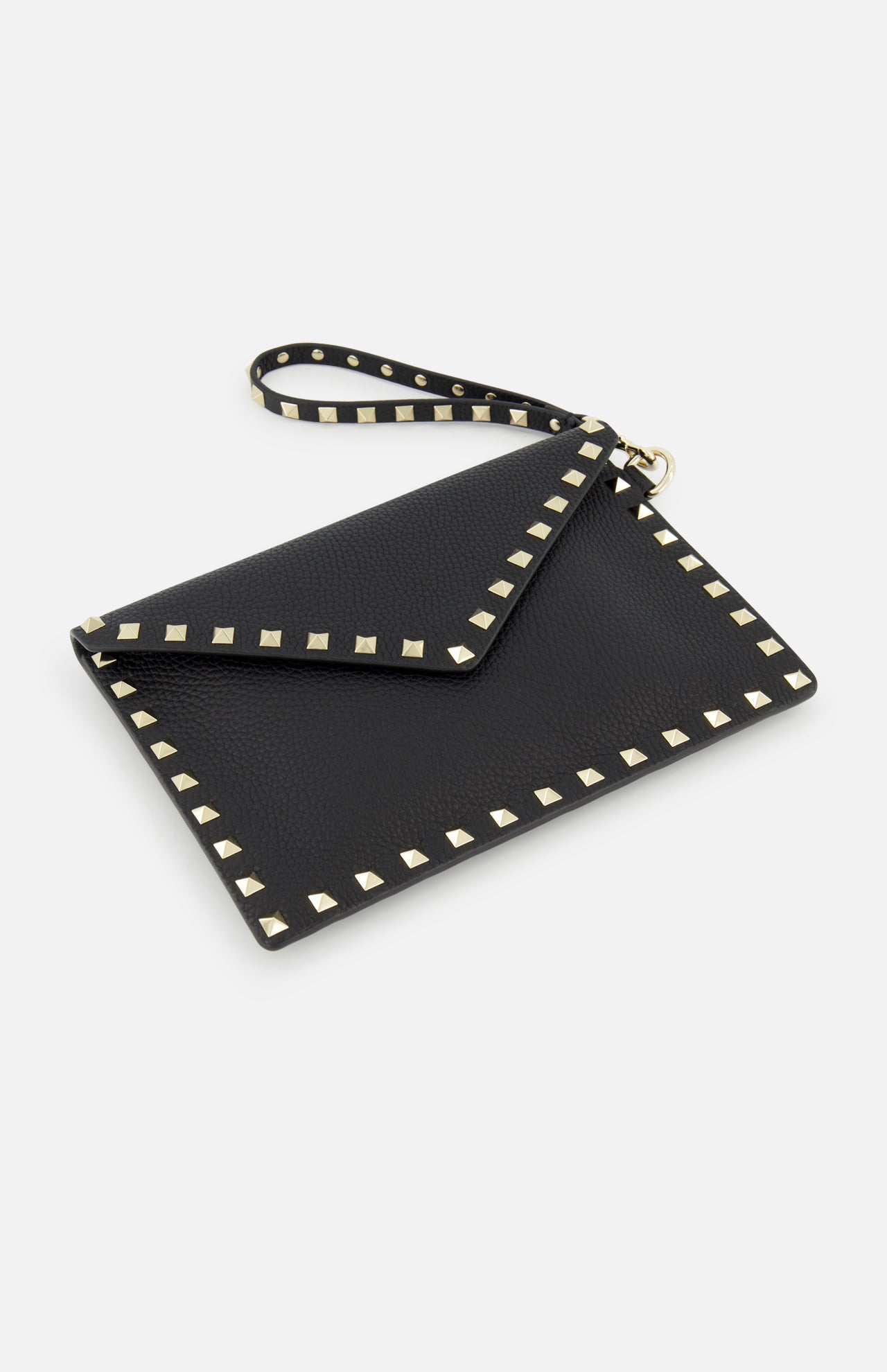 The VALENTINO GARAVANI Rockstud Medium Flat Pouch Clutch is a black leather envelope wristlet, adorned with gold square studs along the edges and flap—an elegant evening accessory displayed on a white background.