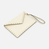 The VALENTINO GARAVANI Rockstud Medium Flat Pouch is an ivory clutch with a chic envelope design, adorned with signature gold rockstuds along the edges and completed with a matching wrist strap, displayed on a white background.