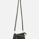 The VALENTINO GARAVANI Rockstud Small Shoulder Bag is a black leather shoulder bag with gold square studs along the edges and a long removable strap, shown against a white background.