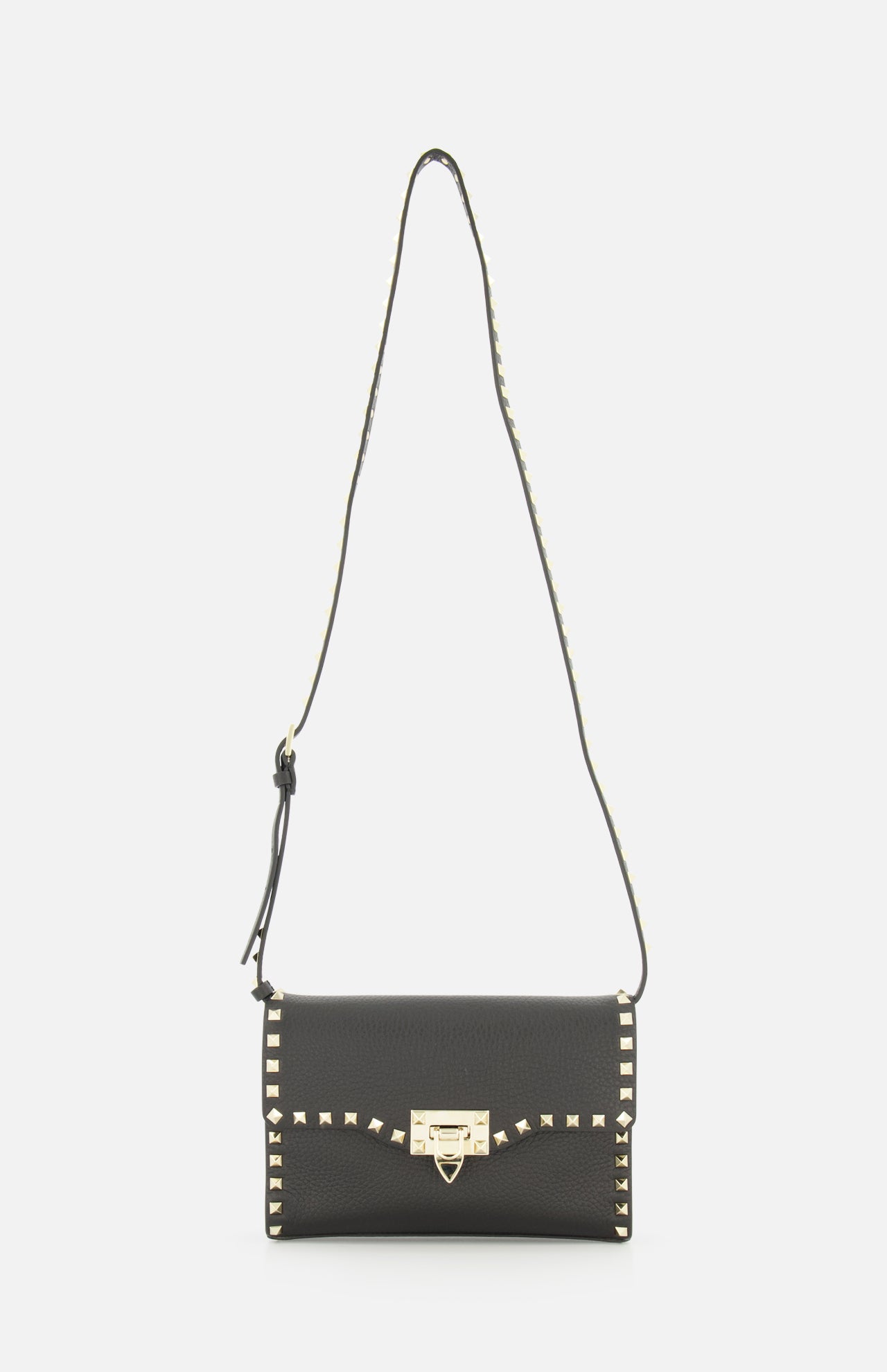 The VALENTINO GARAVANI Rockstud Small Shoulder Bag is crafted from black Italian leather and features gold square studs along the edges, a gold buckle closure at the front, and an adjustable studded strap—an effortlessly chic handbag.