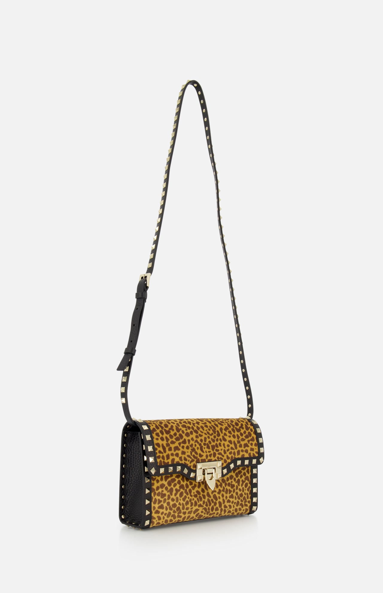 The VALENTINO GARAVANI Rockstud Small Leopard Print Shoulder Bag is crafted from pony-effect calfskin and detailed with black rockstuds, a gold front clasp, and an adjustable black shoulder strap.