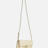 The Rockstud Small Shoulder Bag by VALENTINO GARAVANI is a cream-colored leather crossbody featuring a long strap, gold clasp, and signature square stud accents along the edges, shown against a plain white background.