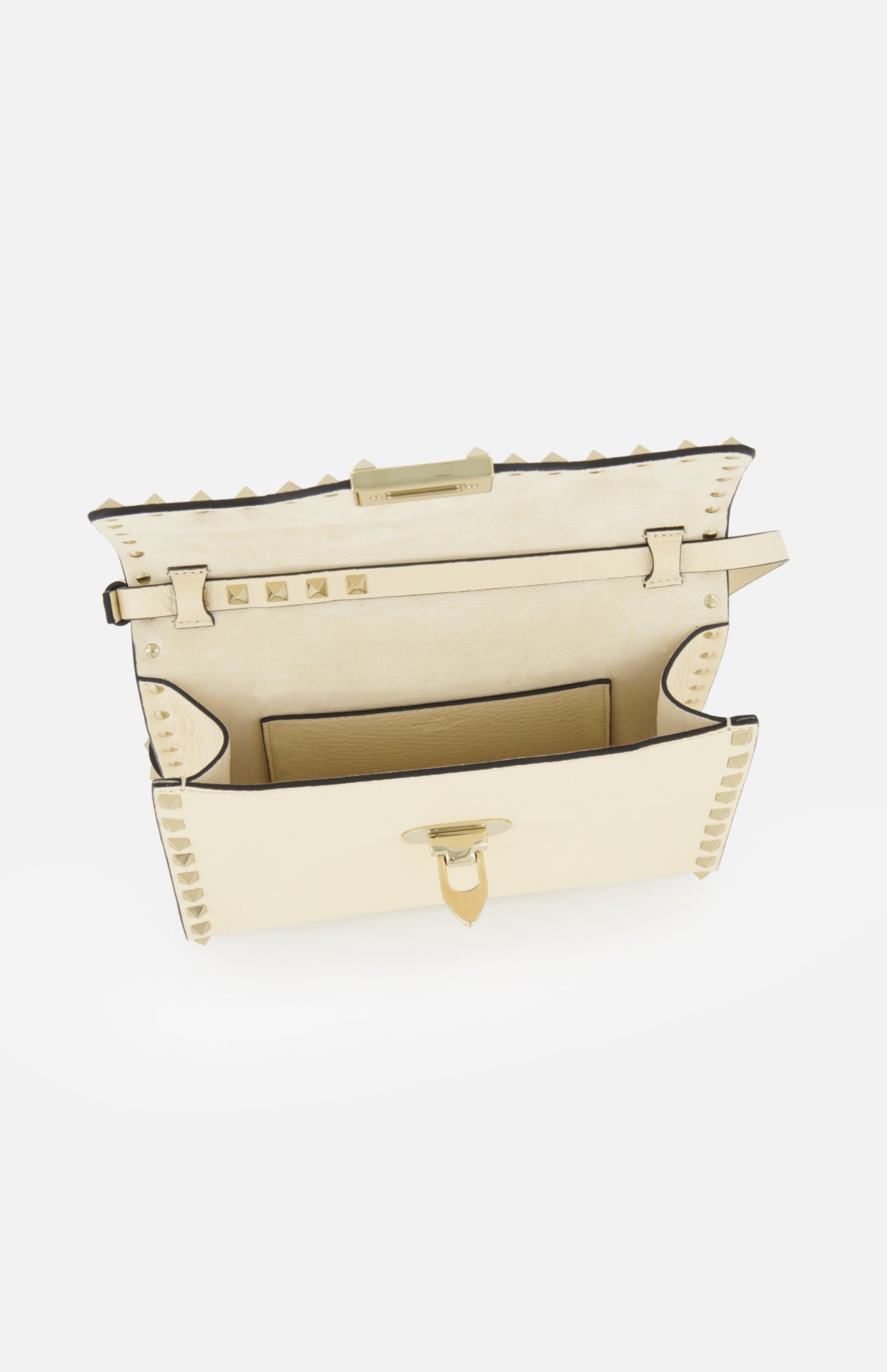 The VALENTINO GARAVANI Rockstud Small Shoulder Bag in beige showcases a flap opening that reveals its interior pocket and striking gold-tone hardware. This elegant leather crossbody bag features the signature Rockstud detailing along the edges and a structured rectangular silhouette, making it a refined accessory for any occasion.