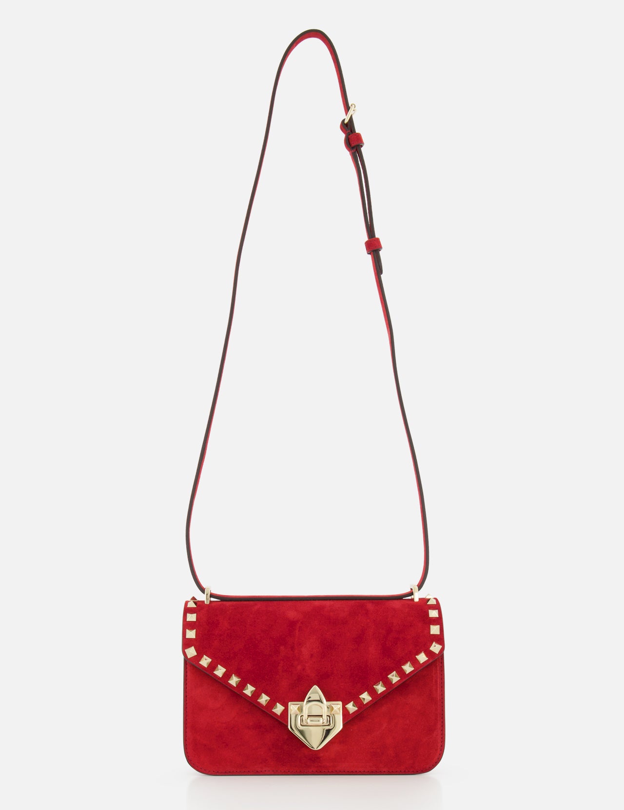 The VALENTINO GARAVANI Rockstud Small Suede Shoulder Bag in lipstick red features gold-tone rockstud trim, a gold clasp, and an adjustable brown leather strap, shown on a plain white background.