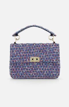 The Rockstud Spike Medium Shoulder Bag by VALENTINO GARAVANI is crafted from multicolored tweed fabric, featuring a short handle and a gold-tone rectangular clasp on the front flap, and is designed to double as a chic shoulder bag.