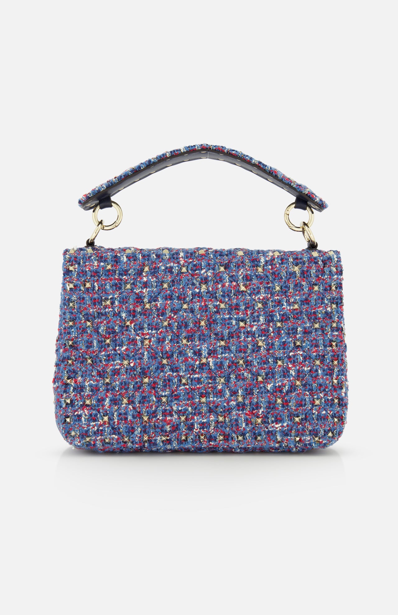 The VALENTINO GARAVANI Rockstud Spike Medium Shoulder Bag, crafted from blue, pink, and white textured tweed and adorned with subtle rockstud spikes, features a short top handle and is showcased against a plain white background.