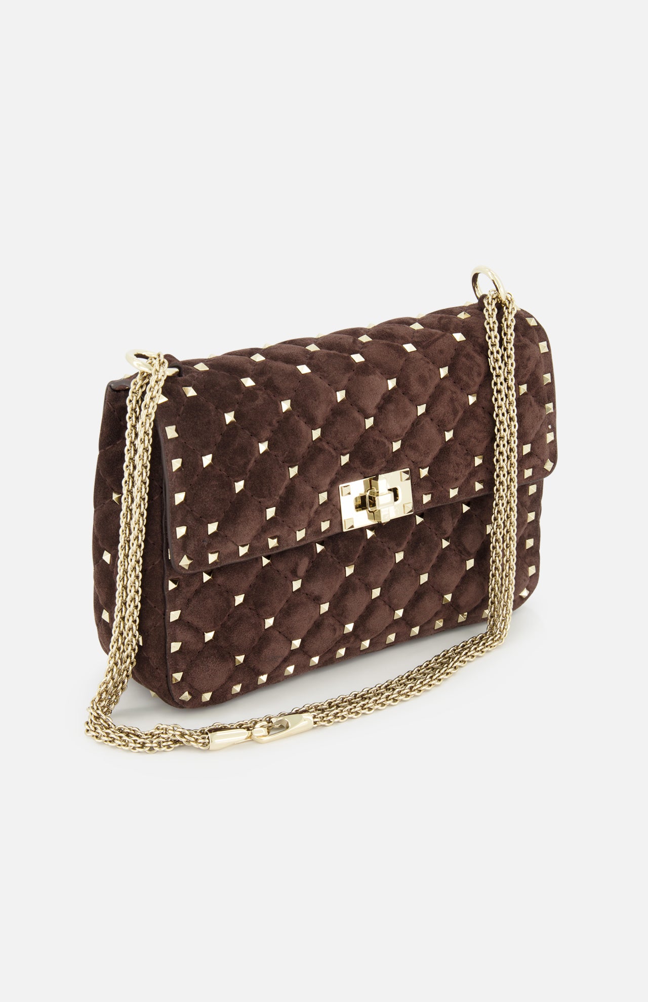 The VALENTINO GARAVANI Rockstud Spike Medium Shoulder Bag in dark brown suede features quilted detailing and micro rockstuds accenting its gold chain strap and clasp closure, displayed against a white background.