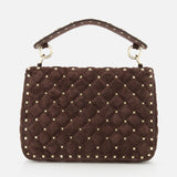 The Rockstud Spike Medium Shoulder Bag by VALENTINO GARAVANI is a dark brown suede quilted crossbody, embellished with gold-tone micro rockstuds and elegant gold hardware, featuring a top handle and displayed against a white background.
