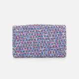 Introducing the VALENTINO GARAVANI Rockstud Spike Shoulder Bag—a rectangular clutch adorned with textured, multicolored woven fabric in shades of blue, purple, pink, and white. Displayed against a plain white background, this chic design features a removable chain strap for versatile styling as either a classic handheld accessory or an elegant shoulder bag.